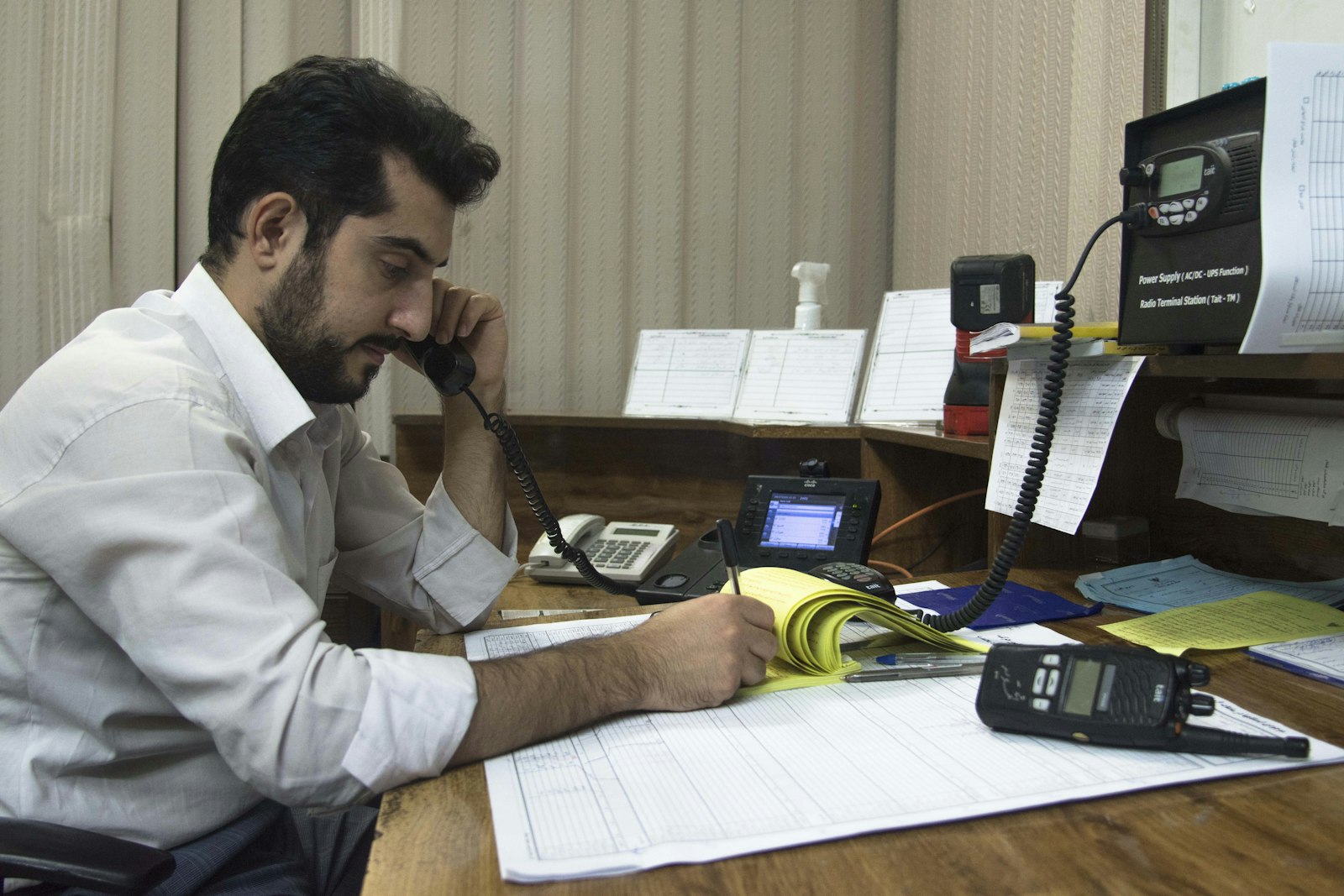 Someone handling a call in finance & collections